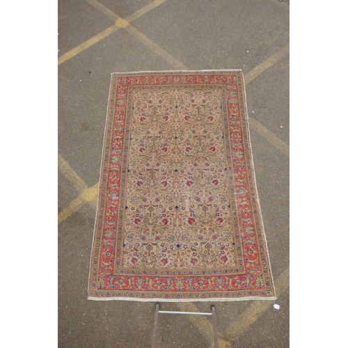 1174 - An antique Anatolian Kayseri cream ground wool rug with multi-colour all over floral design, AF wear... 