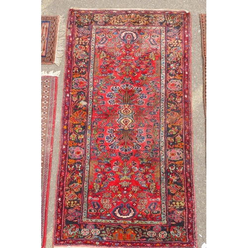 1175 - A Turkish rust ground wool rug with a medallion design, a worn red ground Bokhara runner, a deep pil... 