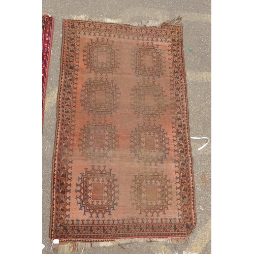 1175 - A Turkish rust ground wool rug with a medallion design, a worn red ground Bokhara runner, a deep pil... 