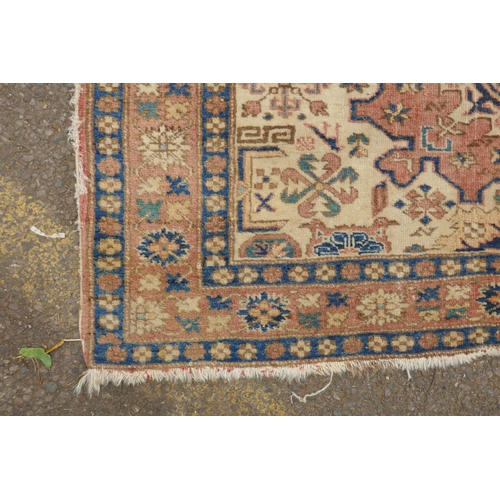 1188 - A gold ground wool Bokhara carpet, signed, 52