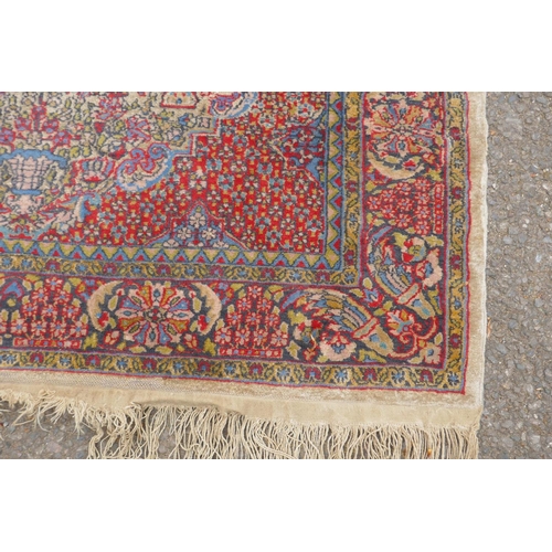 1191 - A Persian multi colour Heriz design silk rug, wear, 38½