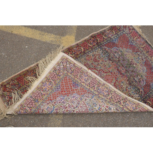 1191 - A Persian multi colour Heriz design silk rug, wear, 38½