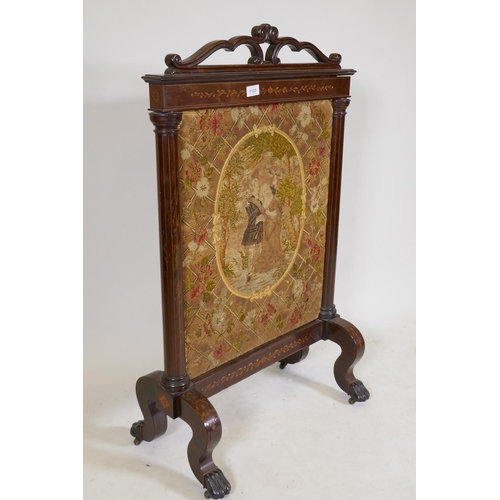 1194 - A Victorian inlaid rosewood fire screen with paw feet, fitted with a tapestry depicting a courting c... 