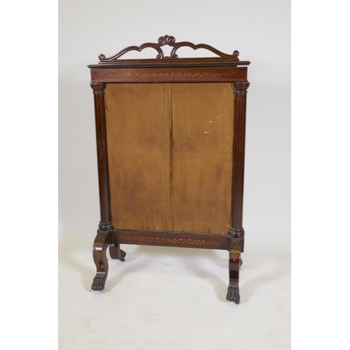 1194 - A Victorian inlaid rosewood fire screen with paw feet, fitted with a tapestry depicting a courting c... 