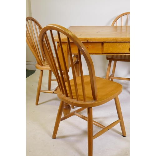 1199 - A pine kitchen table with single drawer and four hoop back beechwood chairs, 34