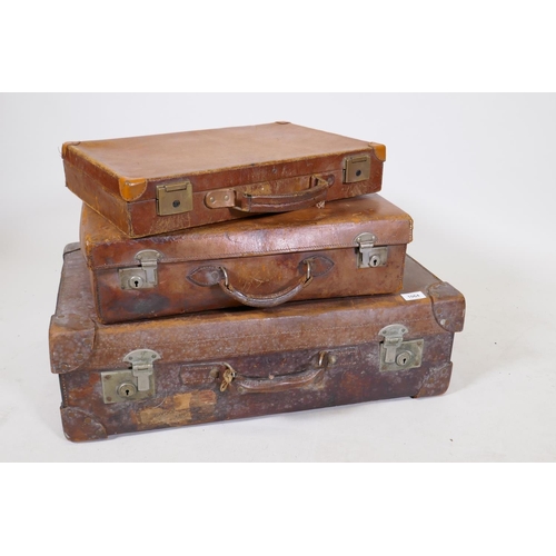 1200 - A vintage leather suitcase by R.W. Forsyth, a smaller leather case and an attache case, 26