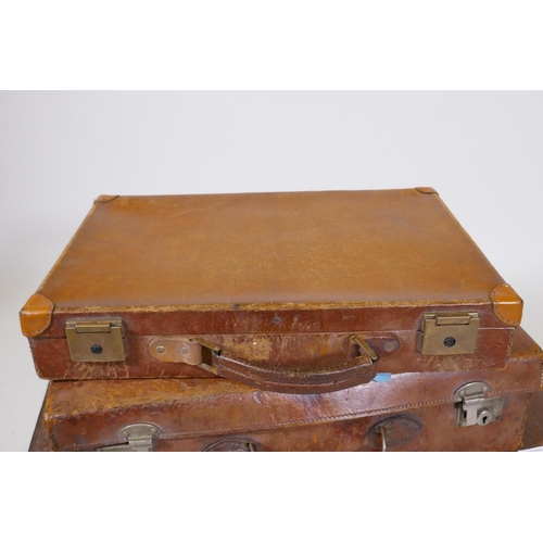 1200 - A vintage leather suitcase by R.W. Forsyth, a smaller leather case and an attache case, 26