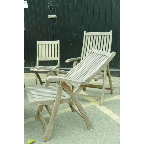 1206 - A set of four teak reclining garden armchairs, a single chair and a drop leaf table with lazy susan,... 