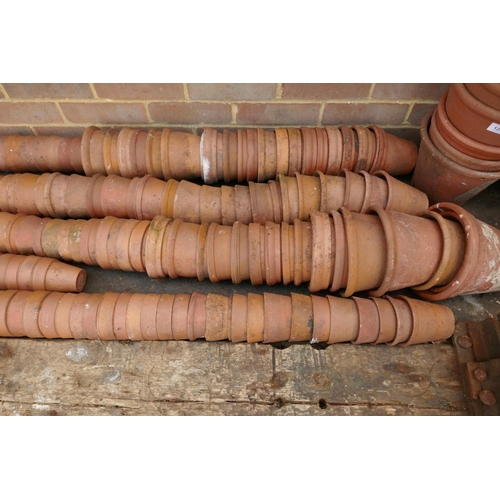 1207 - A large quantity of terracotta plant pots of varying sizes, approx 300, ranging from 7cm to 29cm dia... 