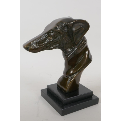 13 - A stylised head bust of a greyhound mounted on a stepped marble base, 23cm high