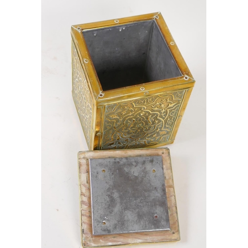 14 - A Chinese embossed brass cased square section tea caddy with metal liner, 10.5cm square