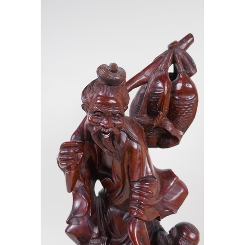 24 - A Chinese root carving of a fisherman with two small boys, 42cm high