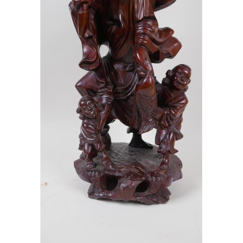 24 - A Chinese root carving of a fisherman with two small boys, 42cm high