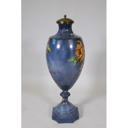 30 - A continental ceramic urn with floral decoration, stamped Bonn, Germany to base, 85cm high