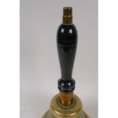 33 - A bronze hand bell with turned wood handle, 33cm long