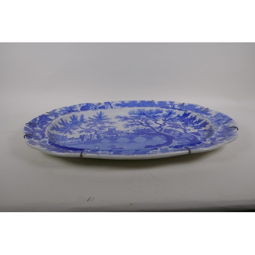 38 - A C19th Henshall & Co blue and white transfer meat plate with castle and bridge decoration, AF c... 