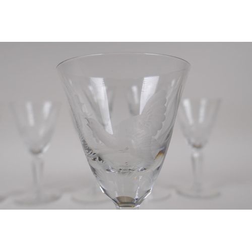 41 - A set of six late C19th sherry glasses with etched decoration of forest animals, 13cm high