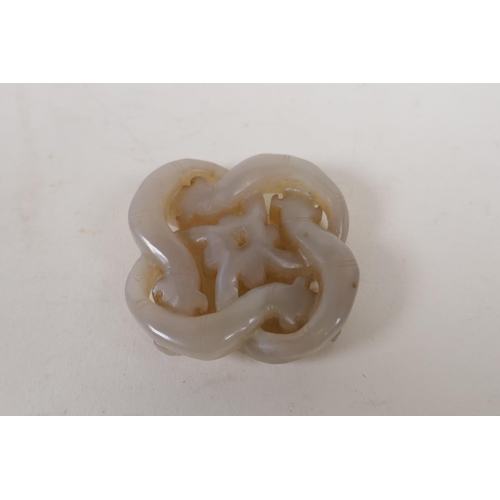 58 - A Chinese grey jade pendant carved in the form of entwined dragons, 5cm x 5cm