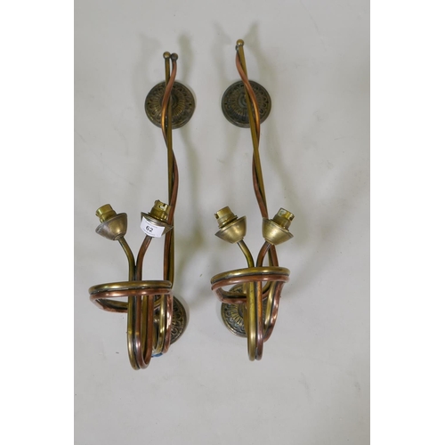 62 - A pair of brass and copper two light wall sconces, 31cm deep x 56cm high