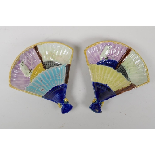 67 - A pair of late C19th/early C20th Majolica fan shaped dishes with an oval design, 19cm x 20cm