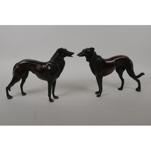 68 - A pair of bronze figures of hounds, 27cm long