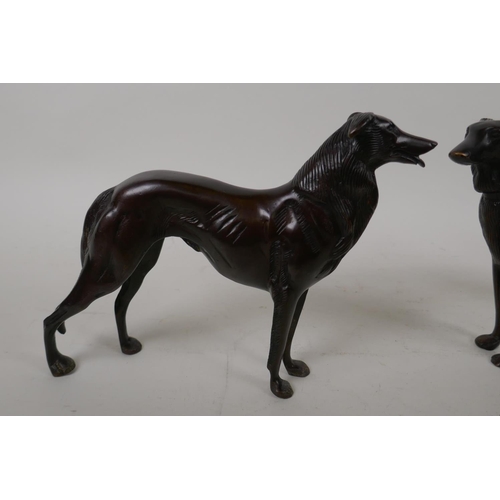 68 - A pair of bronze figures of hounds, 27cm long