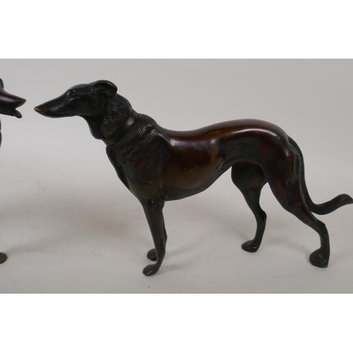 68 - A pair of bronze figures of hounds, 27cm long