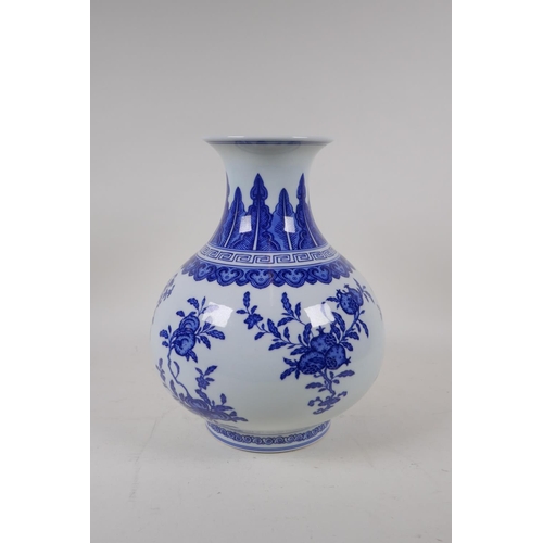 74 - A blue and white porcelain vase decorated with flowers and fruiting peach and pomegranate trees, Chi... 