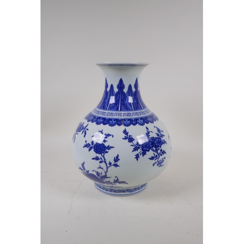 74 - A blue and white porcelain vase decorated with flowers and fruiting peach and pomegranate trees, Chi... 