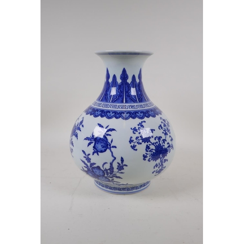 74 - A blue and white porcelain vase decorated with flowers and fruiting peach and pomegranate trees, Chi... 