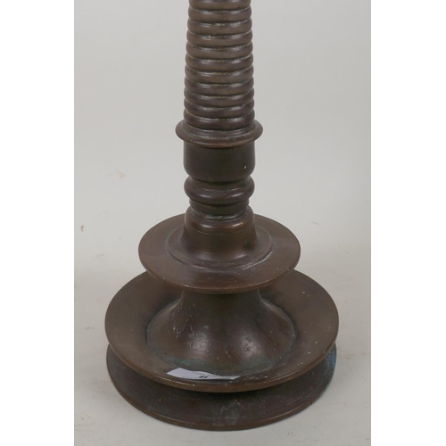 8 - An antique Indian bronze incense burner with shaped top and ring turned column, 39cm high