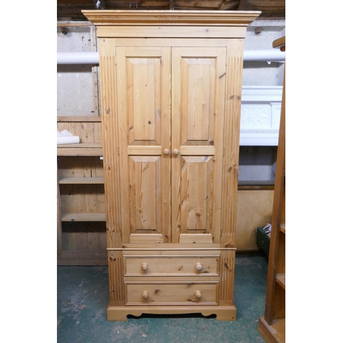 1171 - A pine two door wardrobe, with two drawers to the base, 100 x 68cm, 199cm high