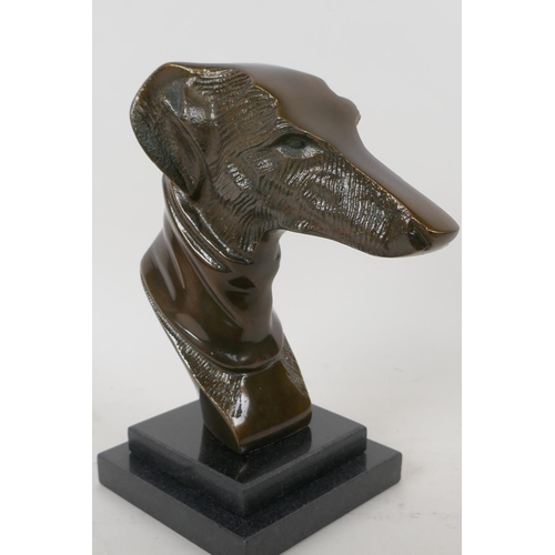 67 - A stylised head bust of a greyhound mounted on a stepped marble base, 23cm high