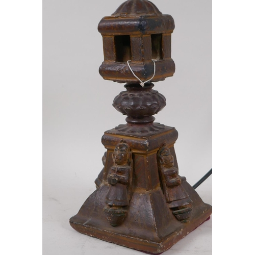 57 - An Indian carved wood table lamp in the form of a temple with applied figural decoration, 44cm high