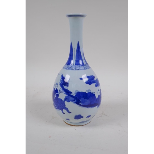 1 - A C19th blue and white porcelain bottle vase decorated with boys playing, Chinese Qianlong 6 charact... 