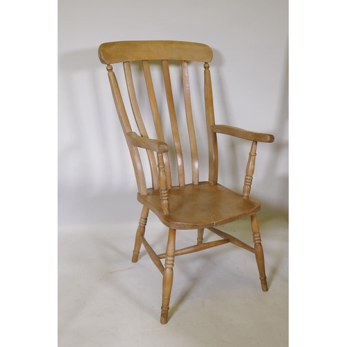 1185 - A C19th Windsor lathe back elbow chair with elm seat, an Oxford elbow chair and bar back elbow chair