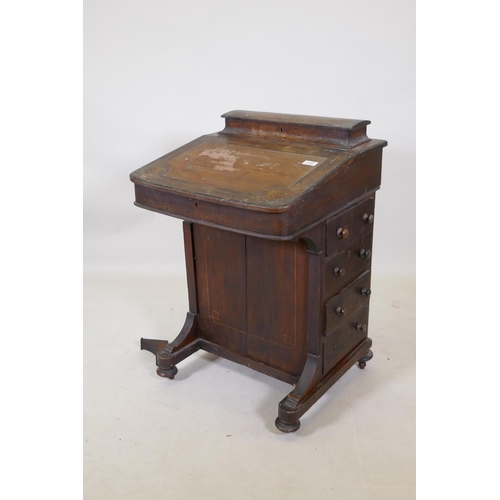 1193 - A Victorian inlaid mahogany davenport with four true and four false drawers and lift up top with fit... 