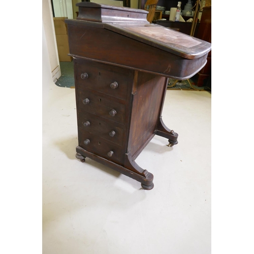 1193 - A Victorian inlaid mahogany davenport with four true and four false drawers and lift up top with fit... 