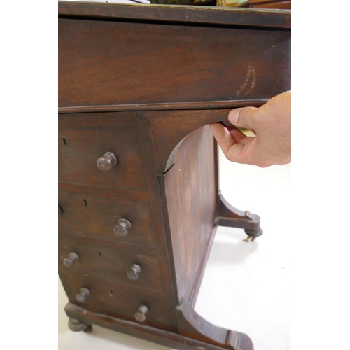 1193 - A Victorian inlaid mahogany davenport with four true and four false drawers and lift up top with fit... 