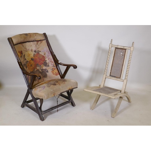 1198 - A C19th walnut open arm chair and a folding steamer type chair