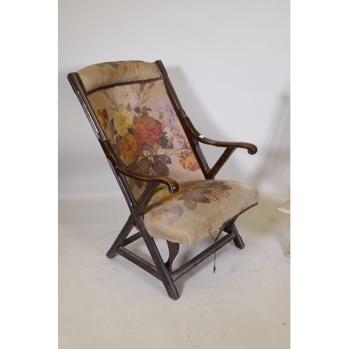 1198 - A C19th walnut open arm chair and a folding steamer type chair