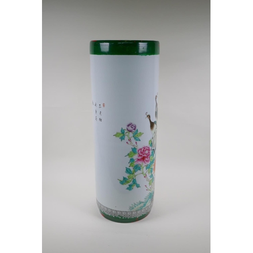 13 - A Chinese famille verte ceramic stick stand, decorated with asiatic birds and flowers, 62cm high