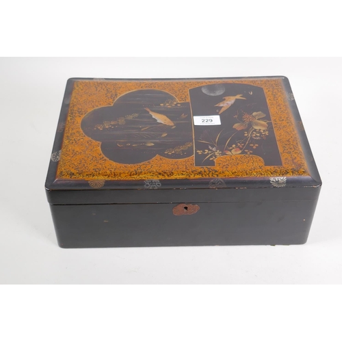 2 - A Meiji lacquer box with gilt decoration of carp and a birds in a moonlit sky, 36 x 26 x 13 cm