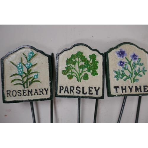 22 - A set of six painted iron herb markers, 27cms long