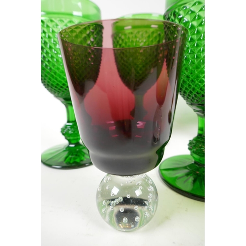 24 - A set of five green pressed glass wine goblets with hobnail design, 16cm, together with two coloured... 