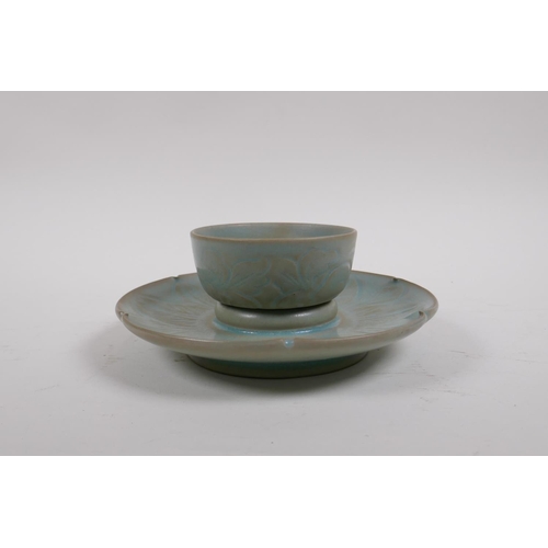 25 - A Chinese Ru ware style celadon glazed tea bowl and saucer with incised petal decoration, 18cm diame... 