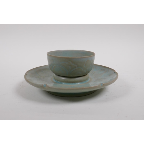 25 - A Chinese Ru ware style celadon glazed tea bowl and saucer with incised petal decoration, 18cm diame... 