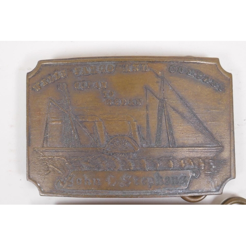 26 - A pair of Tiffany style brass belt buckles advertising 'Wells Cargo' and 'Union Central', 9 x 6cm