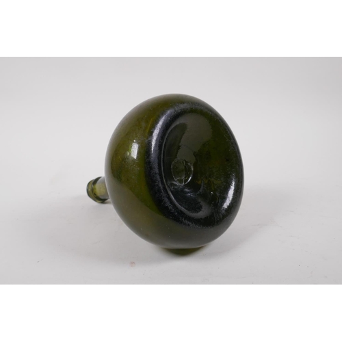 27 - An C18th onion shaped olive green glass wine bottle, 19cm high