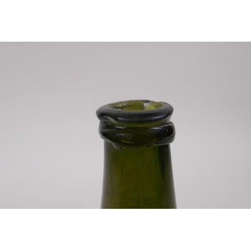 27 - An C18th onion shaped olive green glass wine bottle, 19cm high